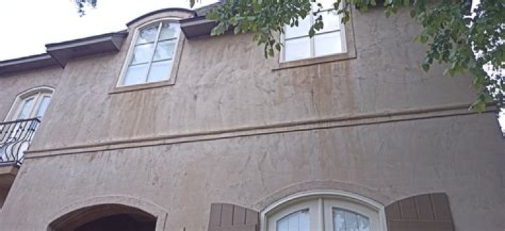 How do you remove dark stains from stucco